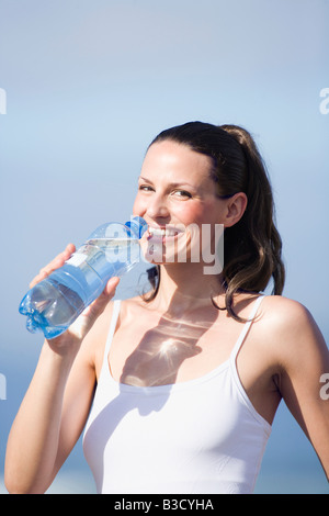 Young woman drinking water, portrait Stock Photo