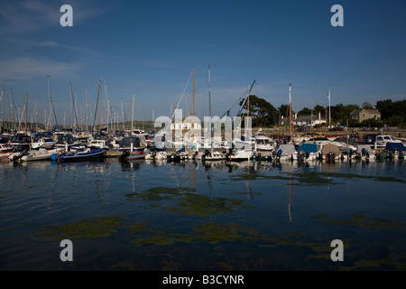 Boats and yachts moored in Mylor Harbour in the Carrick Roads estuary on the River Fal in Cornwall south west England Stock Photo