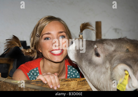 Young woman with cow, portrait Stock Photo