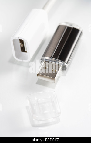Plug and USB flash drive on white background, elevated view Stock Photo