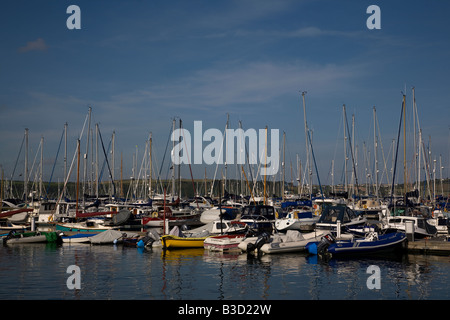 Boats and yachts moored in Mylor Harbour in the Carrick Roads estuary on the River Fal in Cornwall south west England Stock Photo
