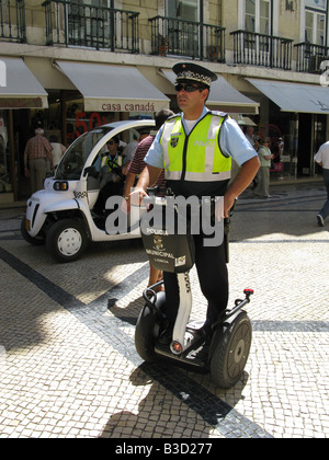 Municipal policeman on a Segway personal transporter patrols Rua Augusta, the central shopping street of Lisbon, Portugal, Europe Stock Photo