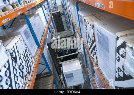 fork lift trunck handling packaging in a warehouse Stock Photo
