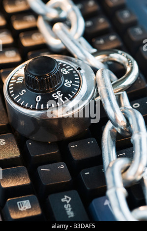 Combination Lock with Chain on Keyboard Stock Photo