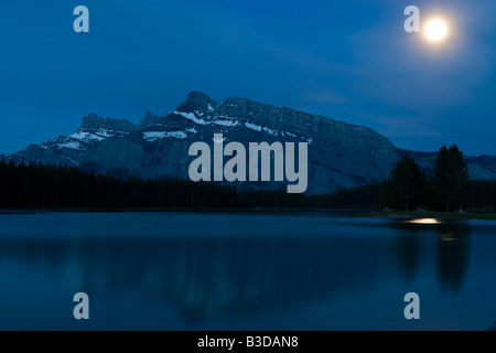 Moonrise over Mount Rundle in Banff National Park Stock Photo