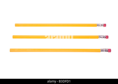 Three Unsharpened Yellow Pencils in three parallel rows on White Background Stock Photo