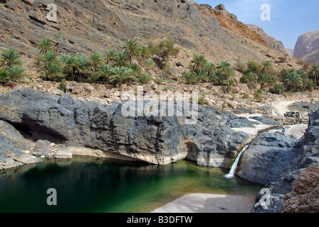 Waterhole and Wadi As Suwayh Sharqiya Region Sultanate of Oman Stock Photo