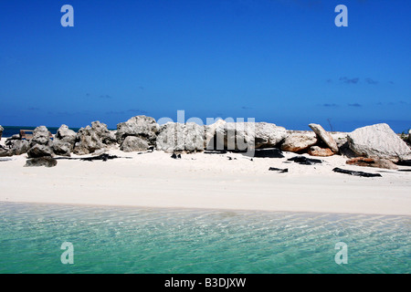 Rocks on a beach at a marina in Turks and Caicos. Stock Photo