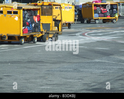 passenger luggage being transported at airport Stock Photo