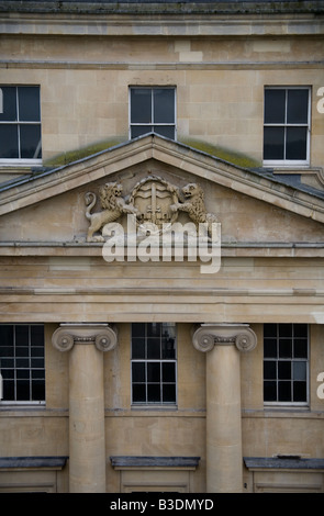 Iconic Ordered columns with scrolled capitals beneath sculpted pediment. Stock Photo