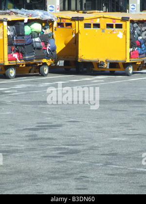 passenger luggage being transported at airport Stock Photo