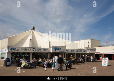 Southport Merseyside England UK July People sitting at tables outside a Fish and Chip shop on seafront esplanade Stock Photo