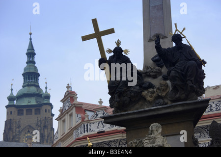 Detail of the St John the Baptist on the Plague Column in Mala Strana square with Prague Castle in the distance in Prague Czech Stock Photo