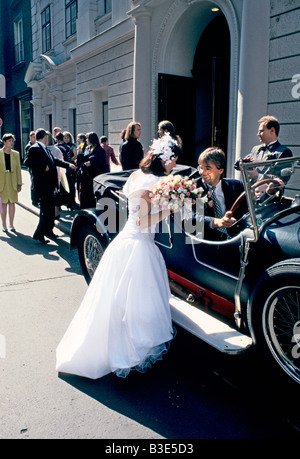 bride and groom with vintage car Stock Photo