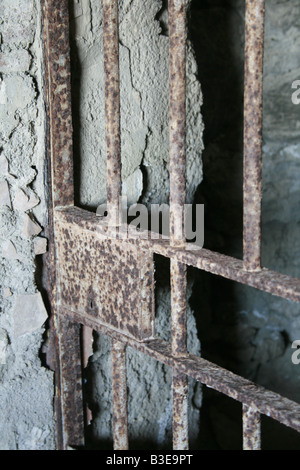 one old moody dark derelict empty prison cell Stock Photo