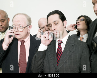 Businesspeople on cellphones Stock Photo