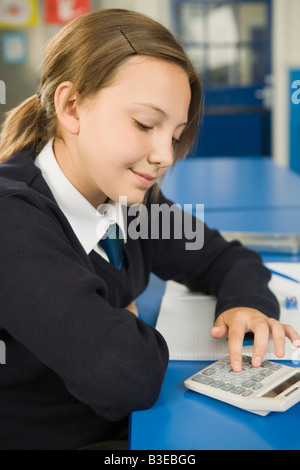 Girl using calculator Stock Photo