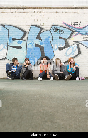 Teens on cellphones Stock Photo