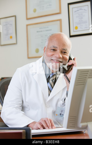 A doctor using the phone Stock Photo