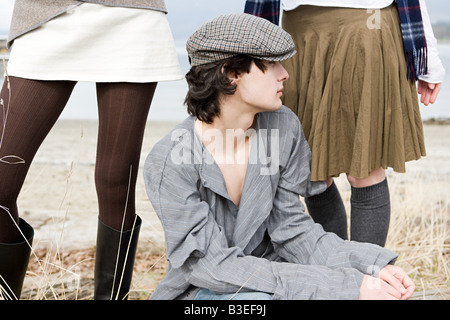 Young man and two young women Stock Photo