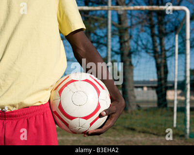 Footballer with a football Stock Photo