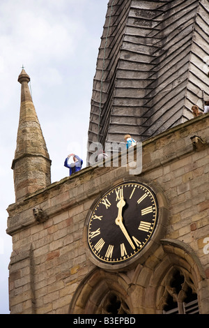 UK Derbyshire Chesterfield Rykneld Square parish church visitors on top of landmark crooked twisting spire Stock Photo