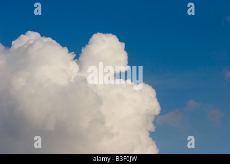 Cumulus clouds against blue sky, England, UK