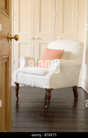 Empty chair shot through doorway Stock Photo