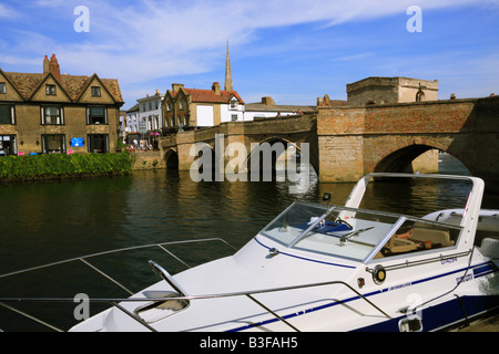 The town bridge in St Ives,Cambridgeshire with a cruiser in the foreground Stock Photo