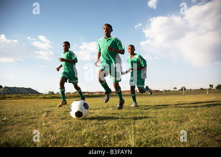13MA-040 © Monkeyapple  aFRIKA Collection  Great Stock !  Young team playing soccer Stock Photo