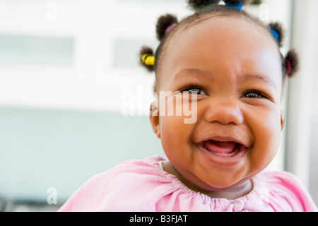 Baby indoors laughing Stock Photo