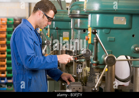 Machinist working on machine Stock Photo