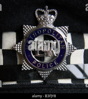 London Metropolitan Police Badge and British money Stock Photo - Alamy