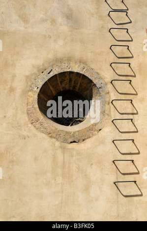 Round deep set window on the western wall of the Prague Old New Staronova Synagogue in the Jewish Quarter Stock Photo