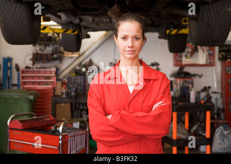 Mechanic standing in garage Stock Photo