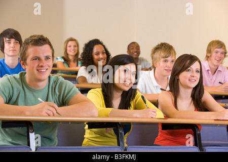Students in class paying attention and taking notes (depth of field) Stock Photo