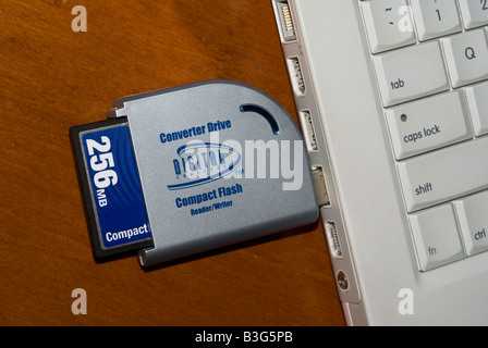 Compact flash memory card in card reader attached to a computer Stock Photo