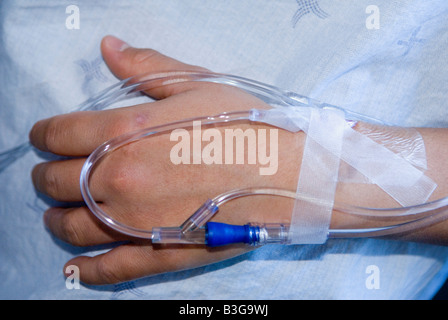 pregnant woman with iv in her hand in hospital. Labor and delivery ...