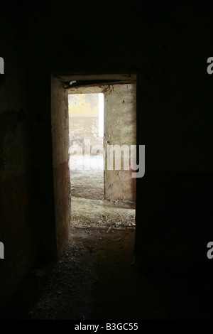 inside dark room in abandoned derelict property Stock Photo