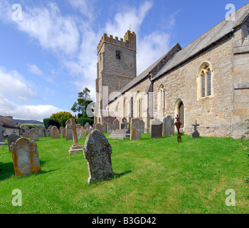 St Marys Church in the village of Dunsford within Dartmoor National Park on a bright sunny afternoon with wispy white cloud Stock Photo