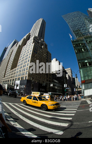 Fisheye lens view of a Taxi on a pedestrian crossing 5th Avenue Manhattan New York City Stock Photo