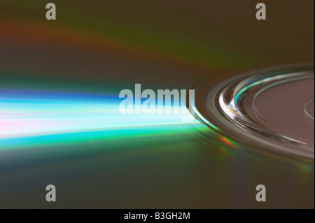 Colourful rays of light reflected on the surface of a DVD Stock Photo