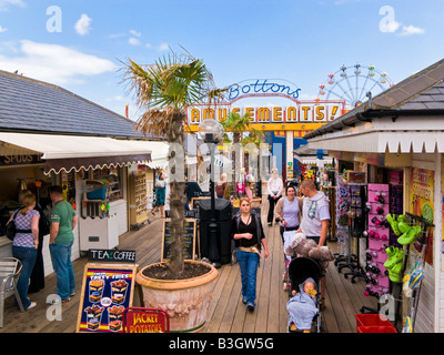 Tourists and stalls at Skegness pleasure beach, Lincolnshire, England, UK Stock Photo
