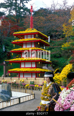 Thousands of real chrysanthemum flowers adorn traditional buildings and mannequins at the annual Kiku Matsuri in Fukushima Stock Photo