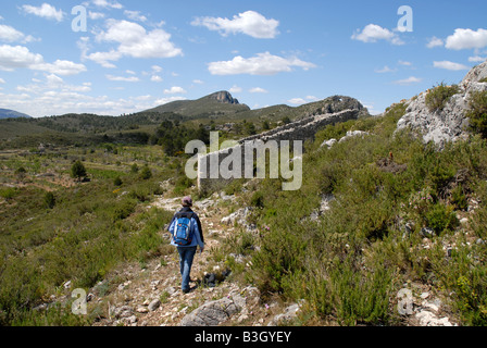 woman hiker near Talaia de la Foradada, Sierra de la Forada, Alicante Province, Comunidad Valenciana, Spain Stock Photo