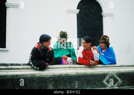 Local teenagers talk outside church in Machachi in the province of Pinchincha in Ecuador, South America. Stock Photo