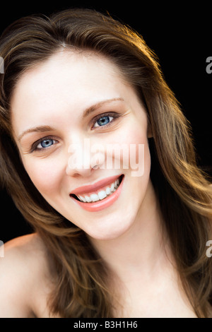 Close up portrait of young adult caucasian female smiling Stock Photo