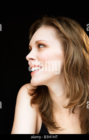 Side view portrait of young adult caucasian female looking off to side Stock Photo
