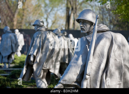 Haunted Look left. A statue of a rifle toting US soldier fighting in Korea with a haunted tired dispirited look on his face Stock Photo