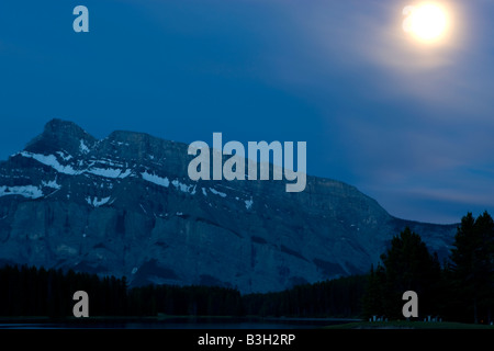 Moonrise over Mount Rundle in Banff National Park Stock Photo